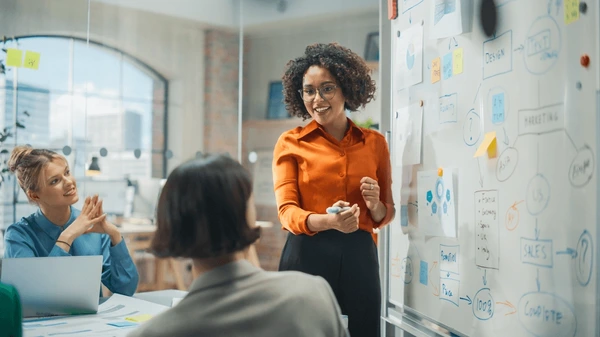 A professional representation of a Black woman leader navigating systemic organisational dynamics and executive authority.